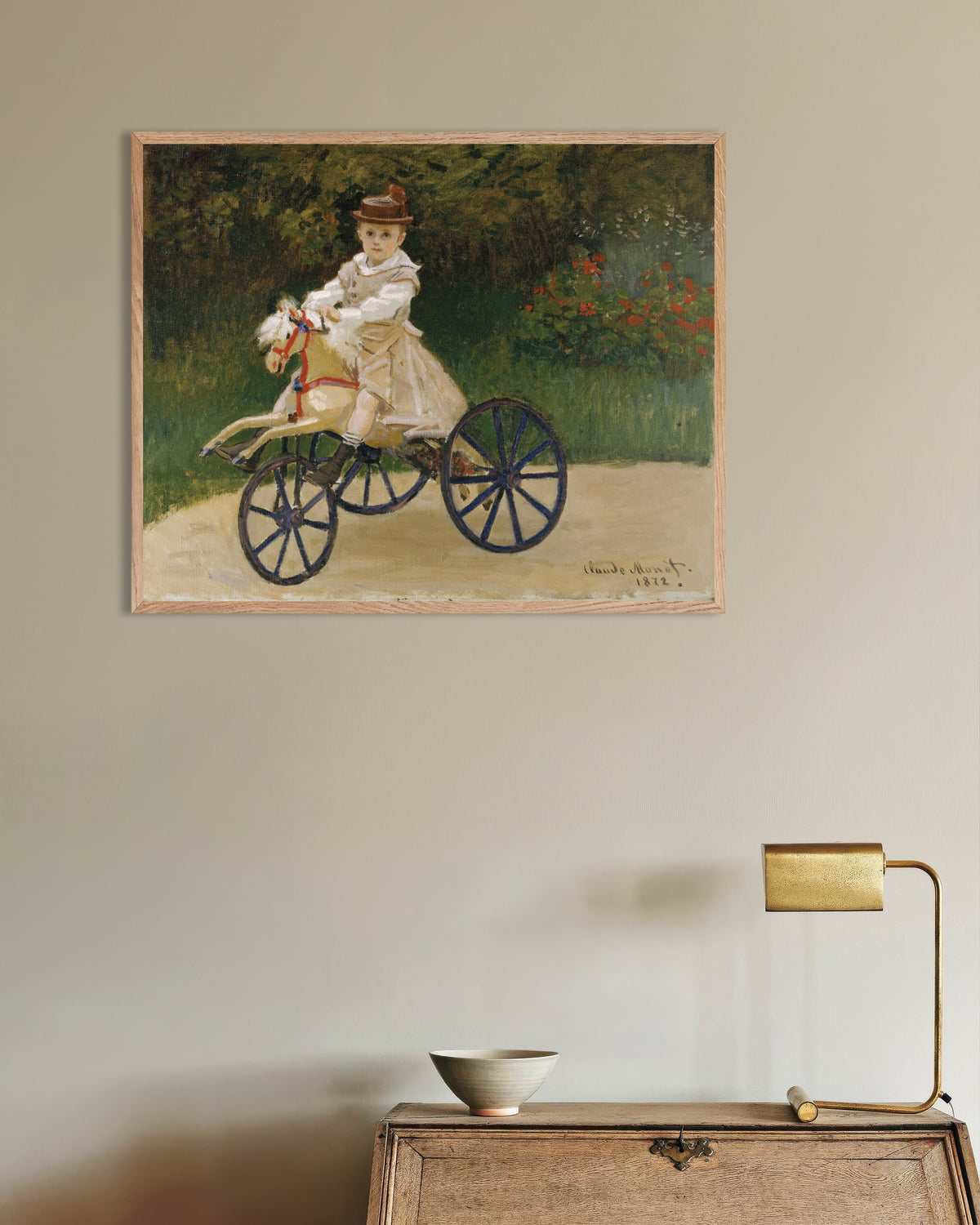 Poster Jean Monet op zijn stokpaardje (1872) van Claude Monet met naturel houten lijst