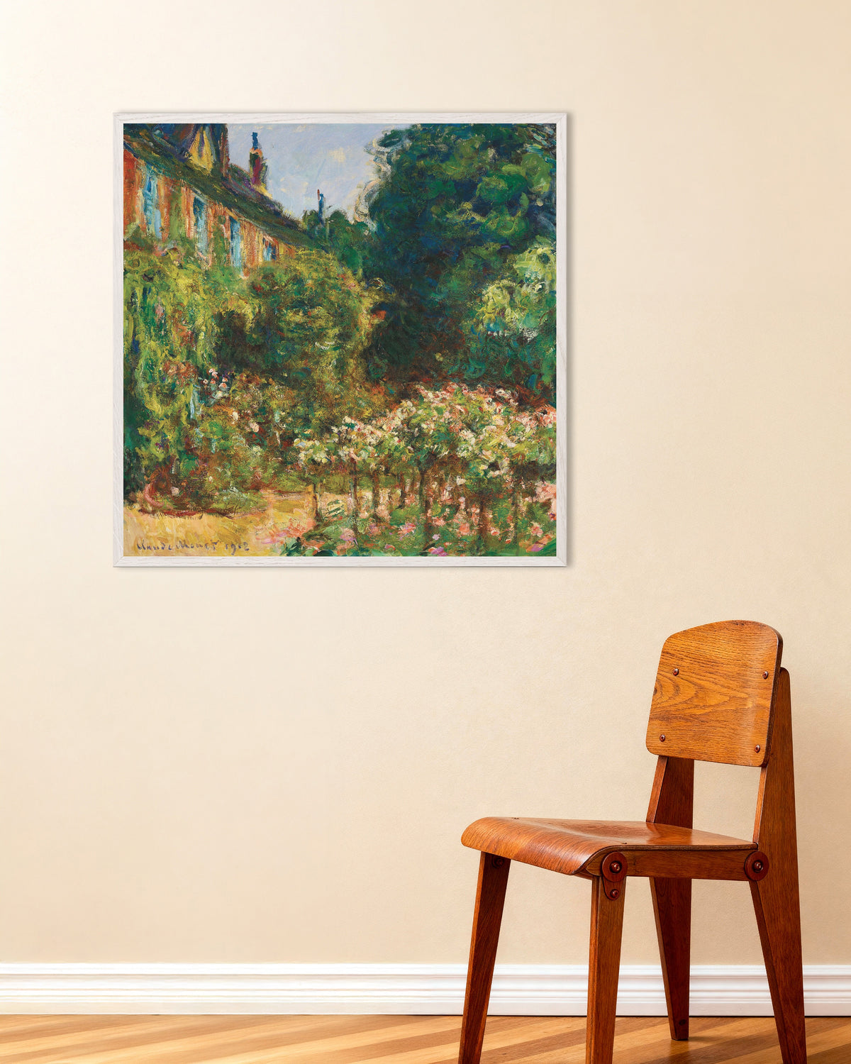 Poster Het huis van de kunstenaar in Giverny (1912) van Claude Monet met witte houten lijst