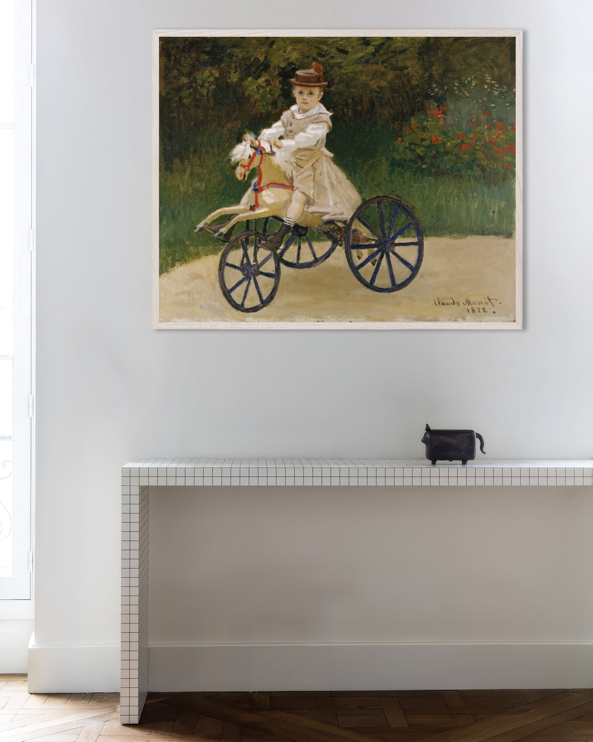 Poster Jean Monet op zijn stokpaardje (1872) van Claude Monet met witte houten lijst
